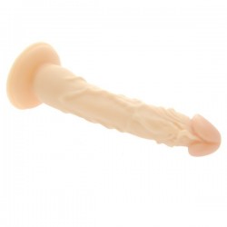 7 inch dildo laying on its side with a suction cup base and lots of veins along the shaft